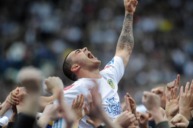Bradley Johnson celebrates with the Elland Road faithful after Leeds United won promotion back to the Championship in 2010.
