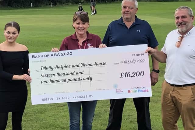 Trinity and Brian House hospices received a cheque from the Thatched House Golf Society, after its golf tournament raised over 16,000.