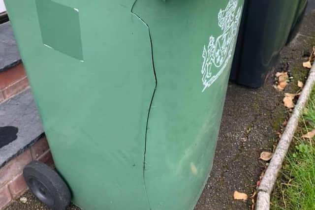 Thornton resident Lisa Martin received her green bin back from the binmen with two cracks down each side. She has been forced to tape the bin up after refusing to pay Wyre Council's "unfair" bin replacement charges.