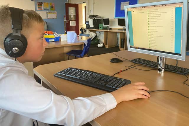 Montgomery Academy pupil Ryan Wright demonstrates online learning