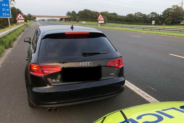 The driver of this Audi A3 was stopped on the M55 outside Blackpool after being caught reaching speeds of 110mph with three young children sat in the back. Pic: Lancs Road Police