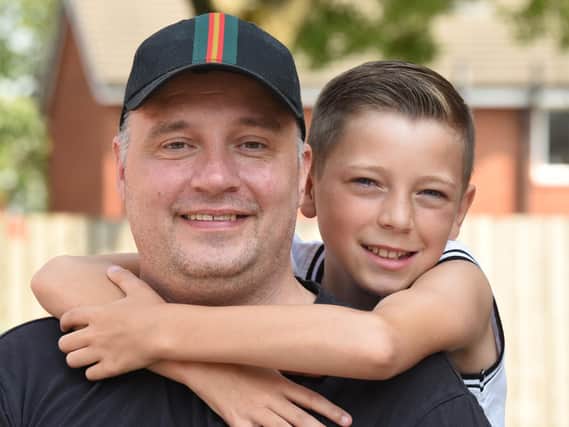 Rob Ryder with son Kai, who raised 1,000 for a holiday after finding out about his dad's cancer