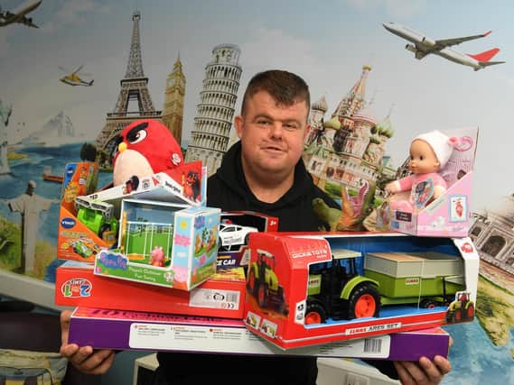 Big Ryan Smith, seen here with presents for Brian House children's hospice, has organised a weekly soup kitchen