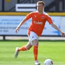 Calum Macdonald will link up with his former Blackpool captain Jay Spearing and coach Ian Dawes at Tranmere