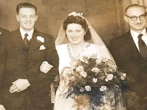 Alan and Joan Watson on their wedding day with father of the bride Harry Houlker (right).