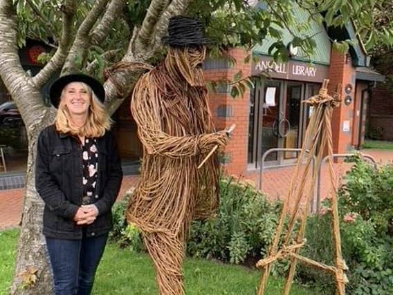 Artist Helena Lemper with her willow figure of Richard Ansdell