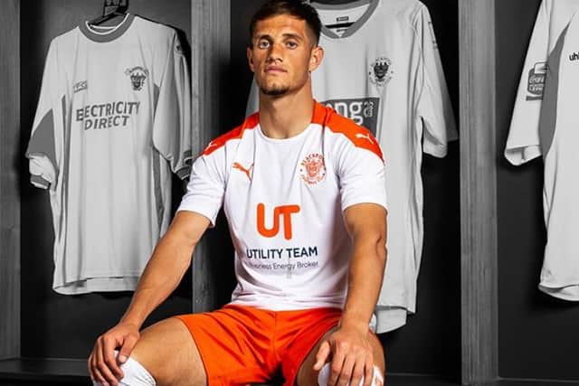 Jerry Yates modelling Blackpool's new away kit
