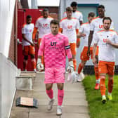 Blackpool captain Chris Maxwell leads his side out to battle