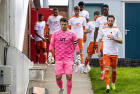 Blackpool captain Chris Maxwell leads his side out to battle