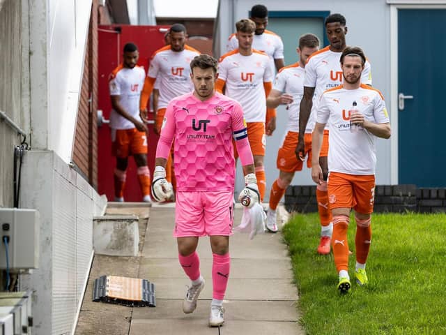 Blackpool captain Chris Maxwell leads his side out to battle