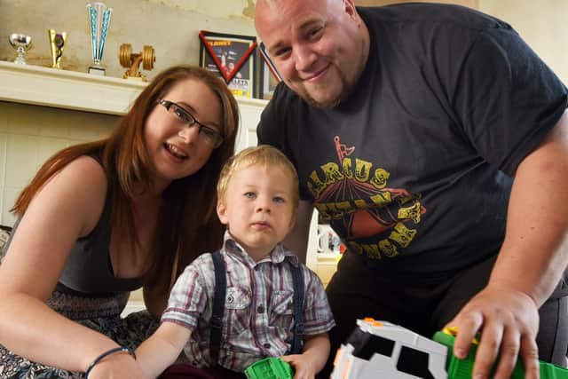 Bruce Stevens, two, has been cheered up by local binmen thoughout lockdown, pictured with parents Steven Stevens and Tanya Stevens.