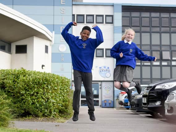 Raheem and Molly-Alice  are jumping for joy to be back at Mereside Primary Academy