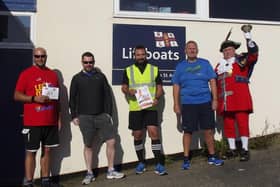 Coxswain Tom Stuart, staff coxswain Andrew McHaffie, crew member John Chamley, coxswain/mechanic Martin Jaggs and Lytham town crier Colin Ballard signal the start of Lytham St Annes RNLI's 2020 Leg It Fun Run month