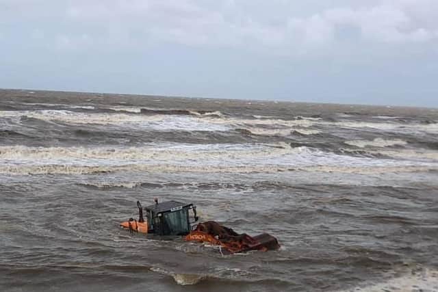 A tractor became stuck in the sand and ended up being swallowed by water as the tide came in. (Photo taken by Lindisfarne Blackpool)
