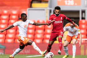 Sullay Kaikai in action against Mo Salah