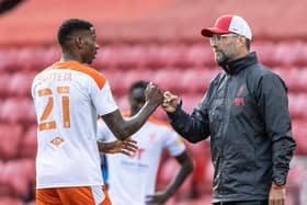 Jurgen Klopp with Blackpool defender Marvin Ekpiteta