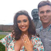 Charlotte Dawson is engaged. Matt Sarsfield pops the question in front of her father's statue in the Sunken Gardens in North Promenade. (picture: Charlotte Dawson Instagram)