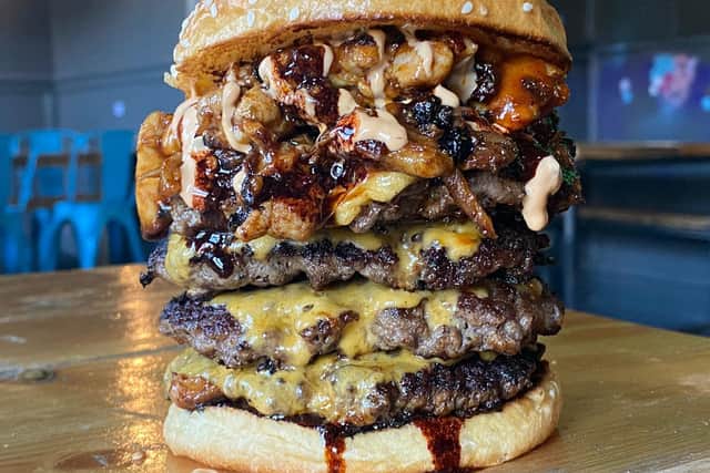 The burger consists of four 6oz patty’s, four american cheese, rib meat, gyro chicken meat, baconnaise and hot sauce. (Credit: The Five-0)