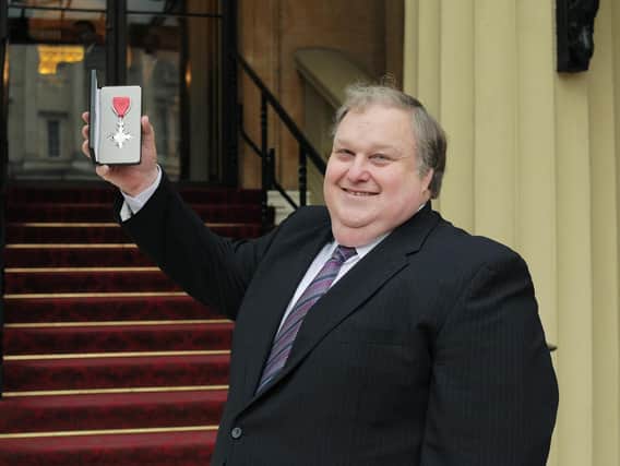 Simon Rigby receiving his MBE in 2017