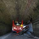 A double-decker school bus crashed into a railway bridge
