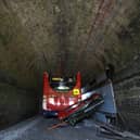 A double-decker school bus crashed into a railway bridge