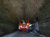 A double-decker school bus crashed into a railway bridge