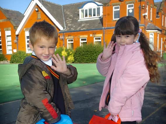 A wave from these children on their first day at Waterloo Road Primary School