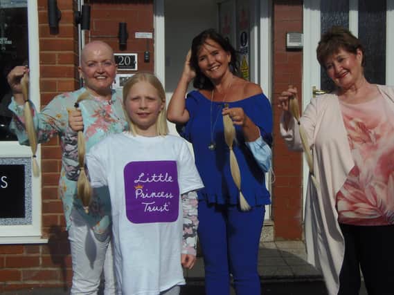 Angel Shackleton with Linda, Maureen, and Denise Nolan who supported her while she had her hair cut for the Little Princess Trust