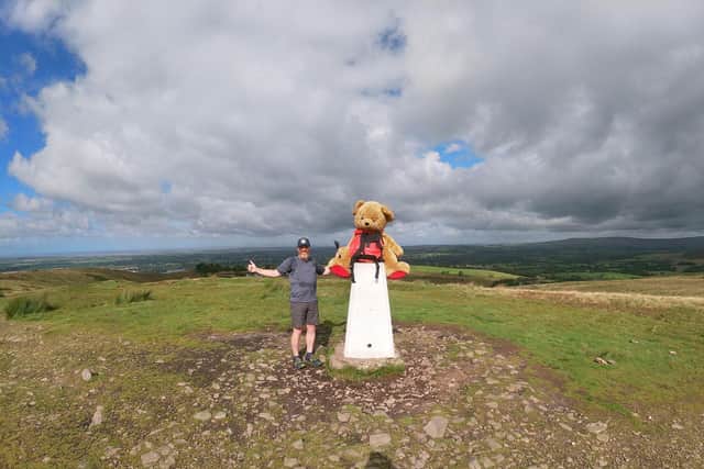 Paul Howlett and his giant teddy had a practice run for the National Three Peaks challenge by hiking up Nicky Nook in Scorton.