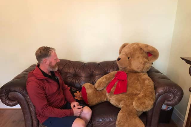 The giant teddy bear Paul Howlett will carry during the Three Peaks Challenge weighs two stone, and a camera and satellite tracker will allow Blackpool's young carers to follow their journey.