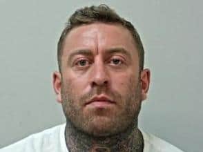 Callum Barron, 31, of Poulton-le-Fylde, has been wanted since September 2 for breaching a restraining order. Pic: Lancashire Police