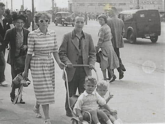 The family enjoying a stroll on Blackpool seafront in the 1950s