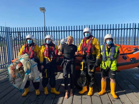 Former World Kitesurfing Champion and model Hannah Whiteley pictured with her RNLI volunteer rescuers at Fleetwood yesterday (Saturday, September 19). Pic: RNLI Fleetwood