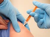 A patient is given a swine flu vaccination