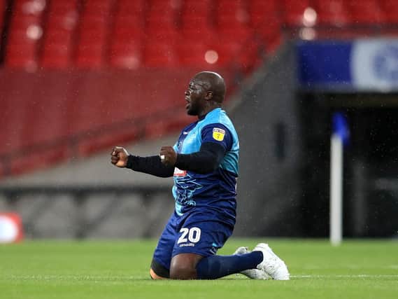 Adebayo Akinfenwa celebrates Wycombe's play-off triumph last season