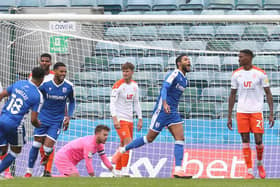 Dominic Samuel celebrates the first of his two goals for Gillingham