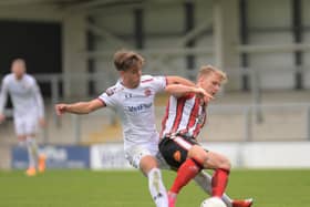 AFC Fylde's Nick Haughton battles with former Coaster Matty Kosylo   Picture: Steve McLellan