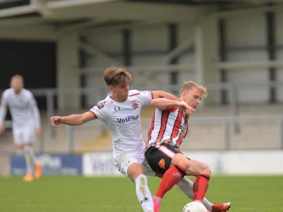 AFC Fylde's Nick Haughton battles with former Coaster Matty Kosylo Picture: Steve McLellan