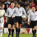 Wayne Rooney tries to get the matchball from the referee after a hat-trick on his debut during the Champions League Group D match between Manchester United and Fenerbahce at Old Trafford on September 28, 2004