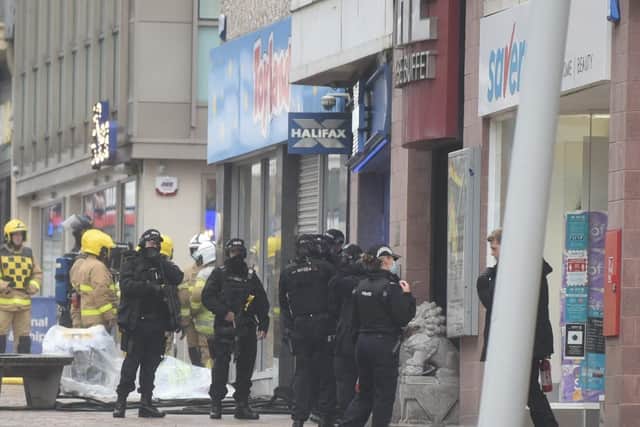 Armed police and specialist negotiators at the scene of the stand-off at Halifax bank in Church Street, Blackpool yesterday (Monday, September 28)