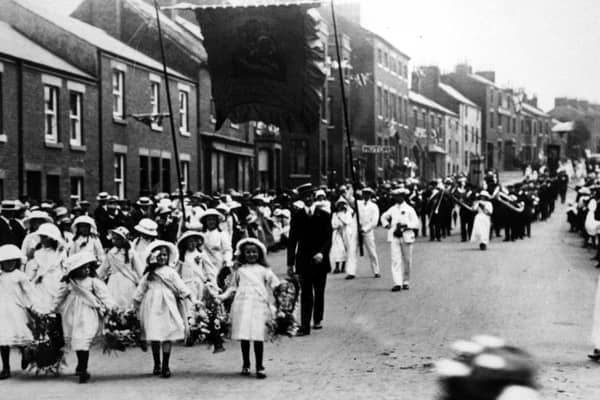Kirkham and Wesham Club day procession - early 1900s - along Poulton Street, Kirkham, led by little flower girls, with brass band in background