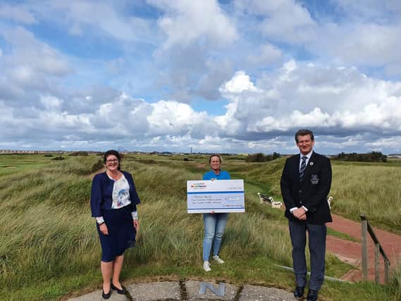 St Annes Old Links Captain David Stanhope and Lady Captain Tina Akroyd are pictured presenting the cheque to Trinity Hospice’s community fundraising manager Michelle Lonican.