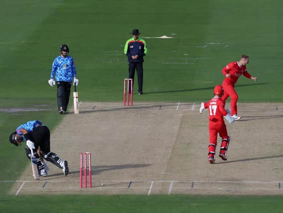 Lancashire's Liam Livingstone celebrates the winning wicket after dismissing Sussex's Tymal Mills