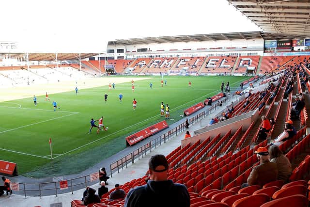 Socially-distanced fans watched Blackpool's win against swindon Town a fortnight ago