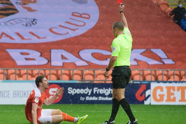 James Husband was shown a red card after conceding a late penalty