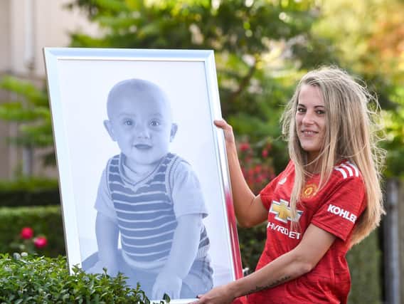 Leah Johnson with a picture of her late son Callum