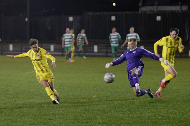 Goal-a-game Nick Haughton scores again, rounding the Farsley keeper to double Fylde's lead Picture: STEVE MCLELLAN