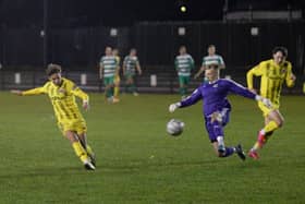 Goal-a-game Nick Haughton scores again, rounding the Farsley keeper to double Fylde's lead Picture: STEVE MCLELLAN