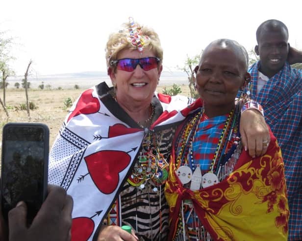 Former Blackpool woman Paula Hammack with members of the Maasai community in Kenya