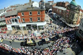 Crowds watch the cortege of Bernie Nolan's funeral as it travels from the Grand Theatre up Corporation Street, Blackpool town centre, on the way to her service at Carleton Crematorium in 2013 (Picture: Iain Lynn for The Gazette)